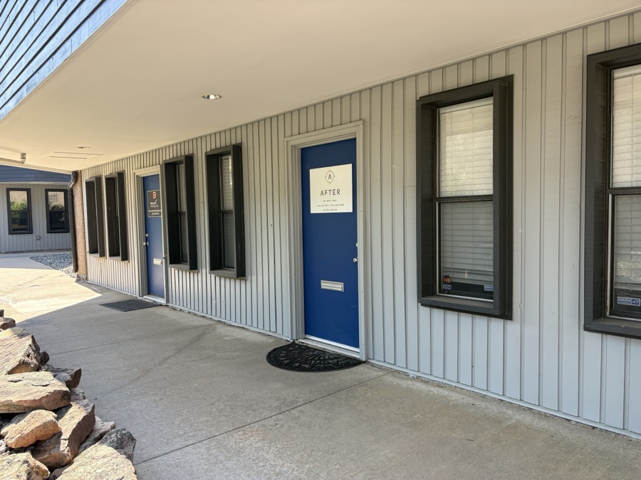 Covered walkway to After's blue office door in Arvada