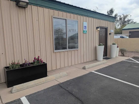 Front entrance of the Mesa office with planters by the door